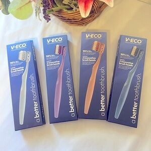 4 Sets 8 Toothbrush’s - Blue, Purple, Pink, and Gray.